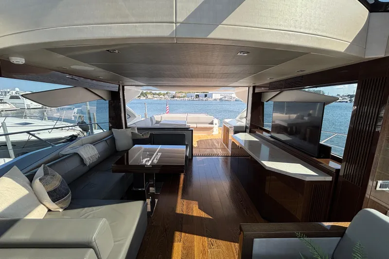  Yacht Photos Pics Luxurious interior of 2018 Sunseeker Predator 74 yacht with elegant seating and waterfront view.