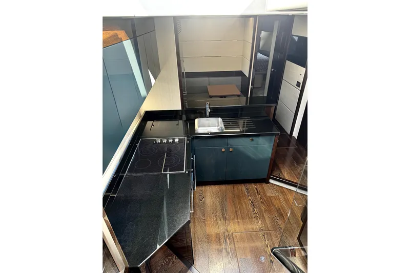  Yacht Photos Pics Luxurious kitchen interior of 2018 Sunseeker Predator 74 yacht with modern appliances.