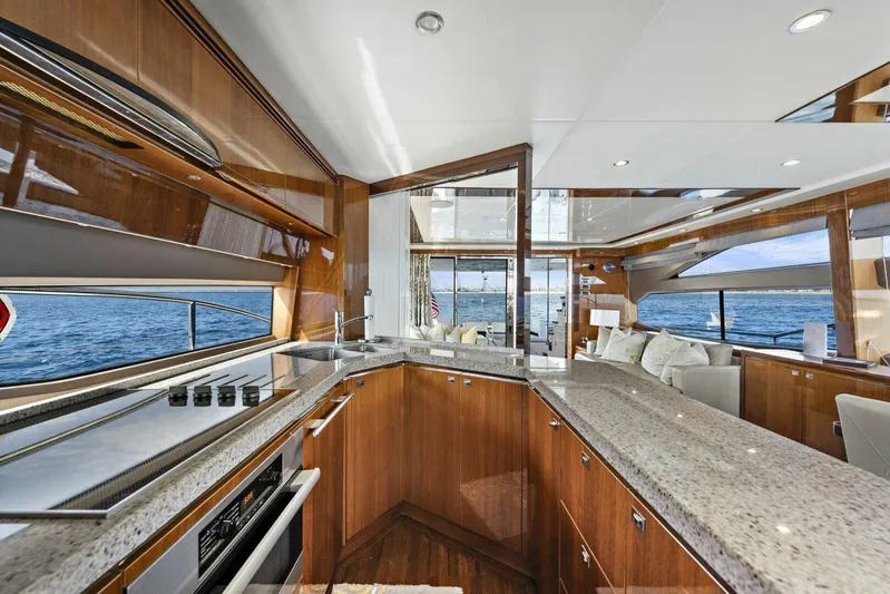 La-z-buoy Yacht Photos Pics Luxurious interior of 2015 Princess 72 Motor Yacht with modern kitchen and ocean view.