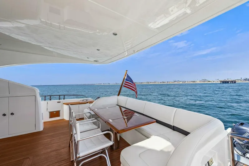La-z-buoy Yacht Photos Pics Luxurious 2015 Princess 72 Motor Yacht deck with seating, table, and ocean view.