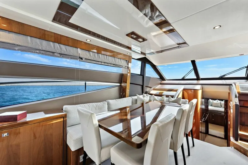 La-z-buoy Yacht Photos Pics Luxurious interior of 2015 Princess 72 Motor Yacht with elegant dining area and panoramic windows.