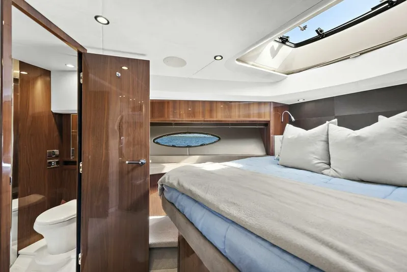 La-z-buoy Yacht Photos Pics Luxurious cabin interior of 2015 Princess 72 Motor Yacht with skylight and ensuite bathroom.