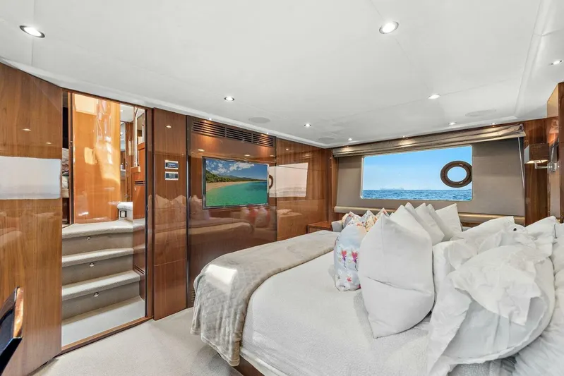 La-z-buoy Yacht Photos Pics Luxurious bedroom interior of 2015 Princess 72 Motor Yacht with ocean view and elegant decor.