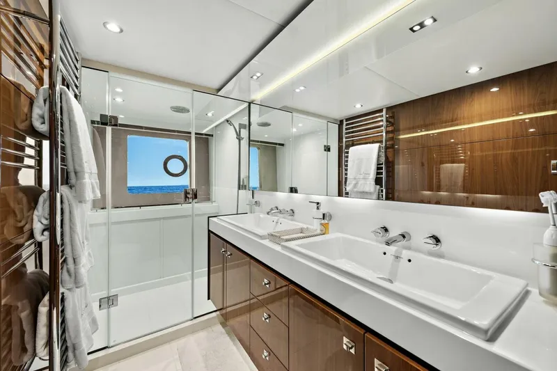 La-z-buoy Yacht Photos Pics Luxurious bathroom on a 2015 Princess 72 Motor Yacht with dual sinks and ocean view.