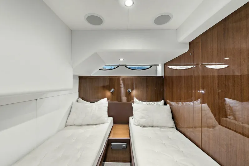 La-z-buoy Yacht Photos Pics Luxurious twin cabin interior on 2015 Princess 72 Motor Yacht, featuring sleek wood paneling.