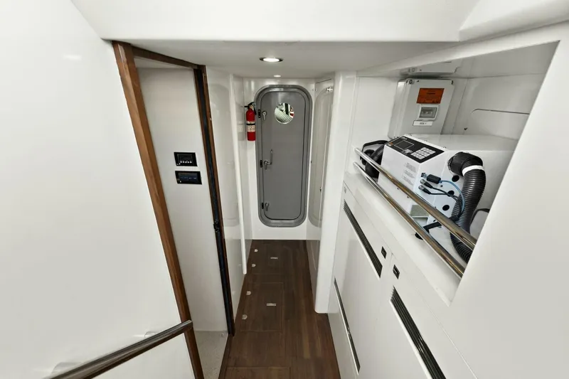 La-z-buoy Yacht Photos Pics Interior of 2015 Princess 72 Motor Yacht, featuring hallway with equipment and safety door.