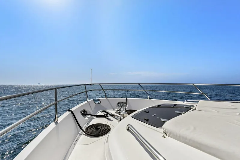 La-z-buoy Yacht Photos Pics Bow view of 2015 Princess 72 Motor Yacht on open sea under clear blue sky.