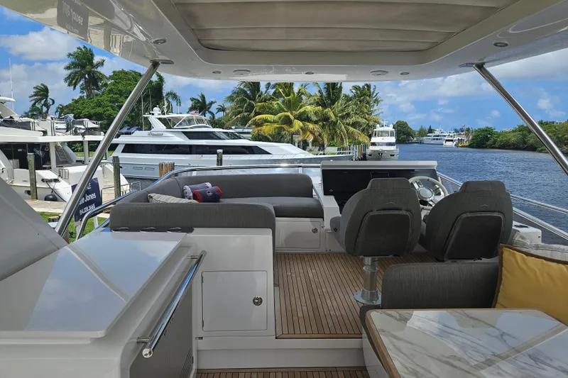  Yacht Photos Pics Luxurious 2022 Azimut 66 yacht interior with elegant seating and scenic waterfront view.