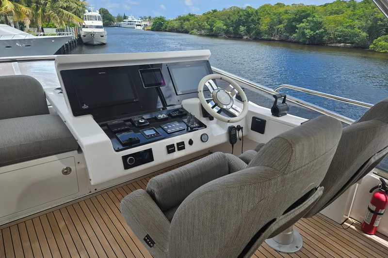  Yacht Photos Pics Helm of 2022 Azimut 66 yacht with modern controls and river view.