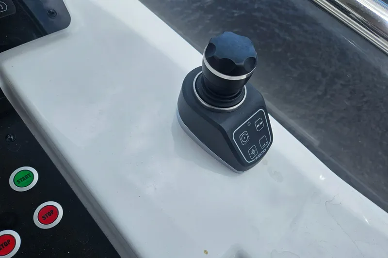  Yacht Photos Pics Joystick control on 2022 Azimut 66 yacht dashboard with start and stop buttons.