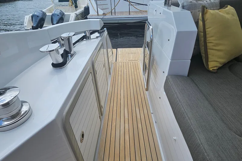  Yacht Photos Pics Luxurious Azimut 66 yacht deck with teak flooring and comfortable seating, 2022 model.