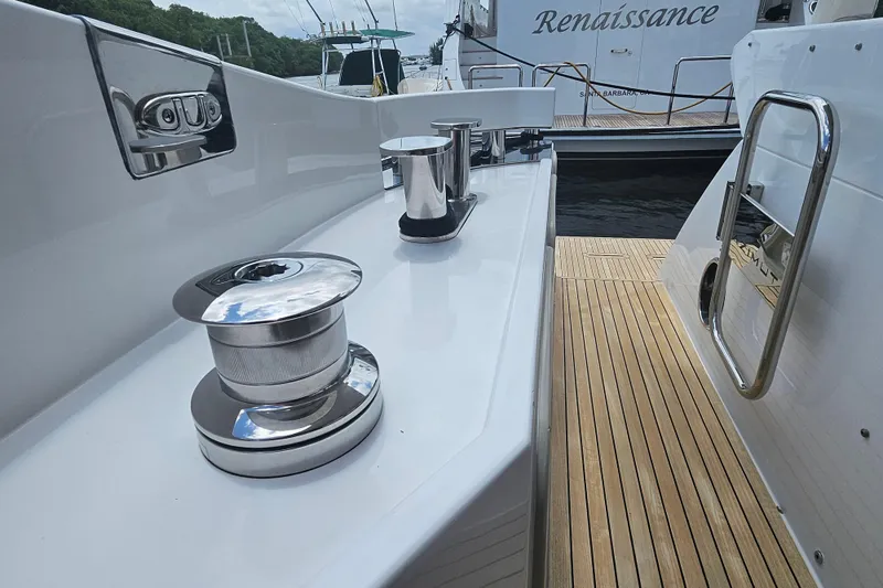  Yacht Photos Pics 2022 Azimut 66 yacht deck with polished winches and teak flooring.