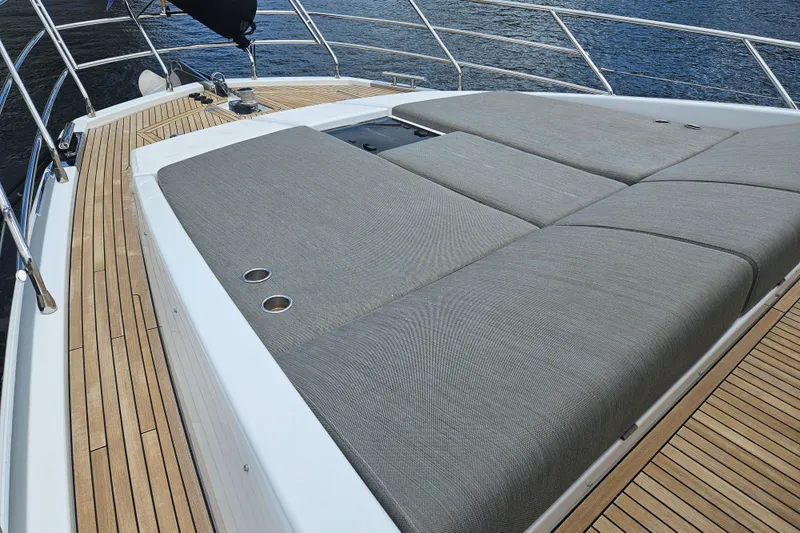  Yacht Photos Pics Luxurious 2022 Azimut 66 yacht with spacious sunbathing deck and elegant teak flooring.