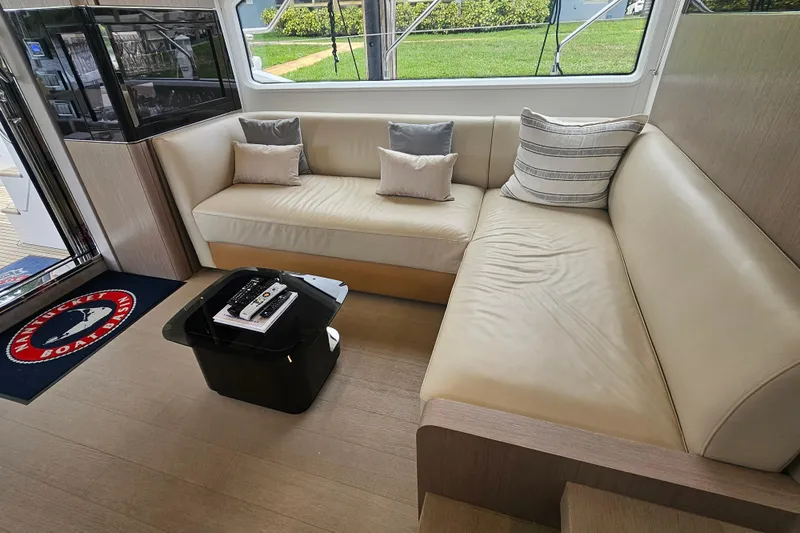  Yacht Photos Pics Luxurious interior of 2022 Azimut 66 yacht with beige leather seating and modern decor.