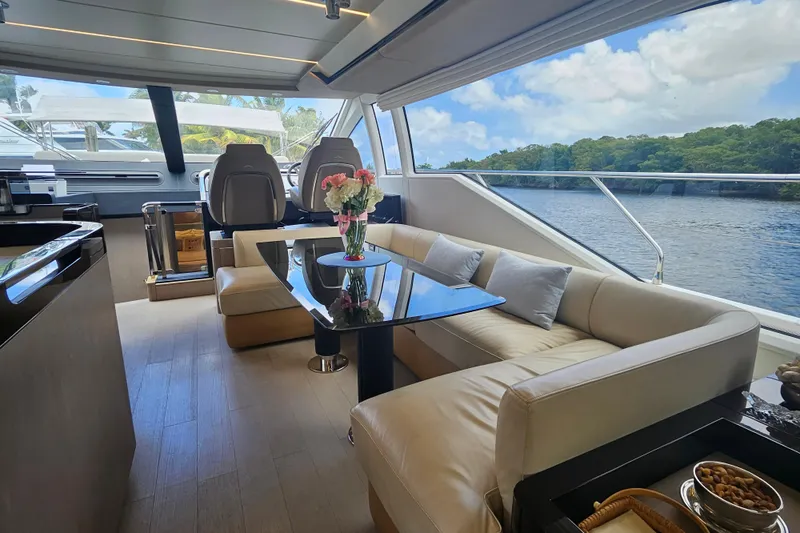  Yacht Photos Pics Luxurious interior of 2022 Azimut 66 yacht with elegant seating and scenic views.