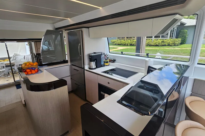  Yacht Photos Pics Luxurious 2022 Azimut 66 yacht kitchen with modern appliances and sleek design.