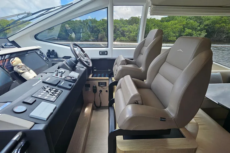  Yacht Photos Pics Luxurious helm of 2022 Azimut 66 yacht with leather seats and advanced controls.