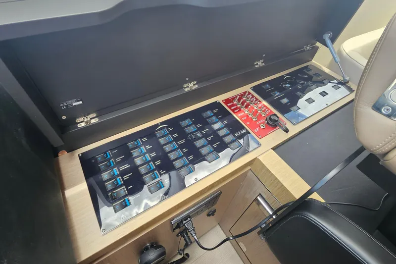  Yacht Photos Pics Control panel of a 2022 Azimut 66 yacht, featuring switches and dials.