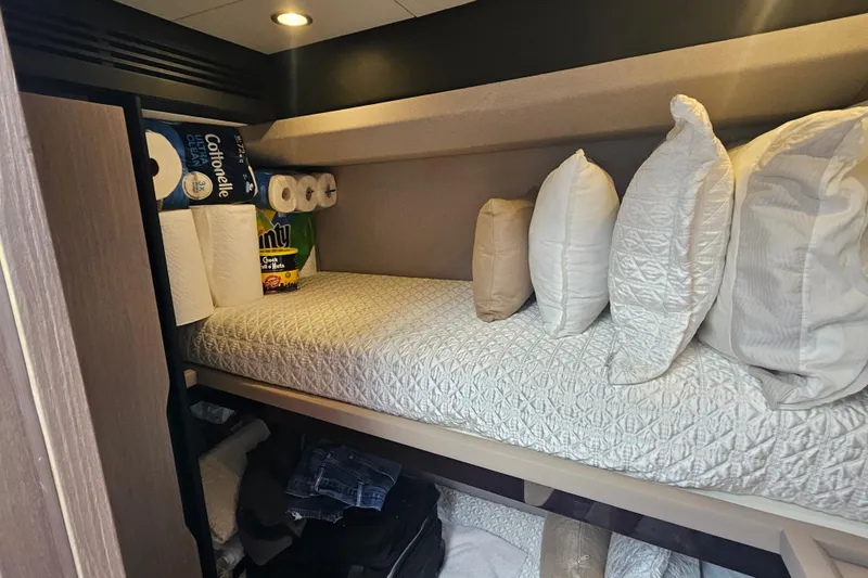  Yacht Photos Pics Cozy Azimut 66 yacht cabin with pillows, storage, and essentials, 2022 model.