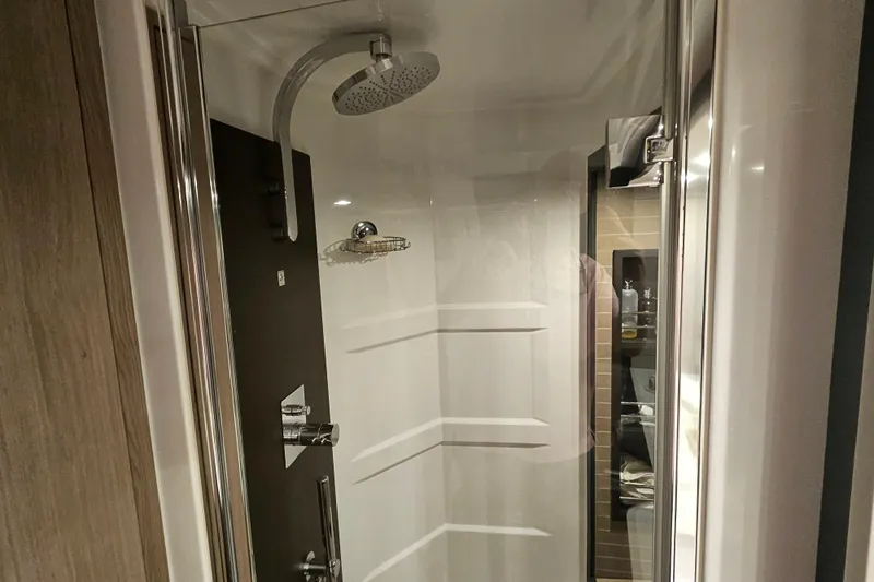  Yacht Photos Pics Luxurious shower in 2022 Azimut 66 yacht, featuring modern fixtures and sleek design.