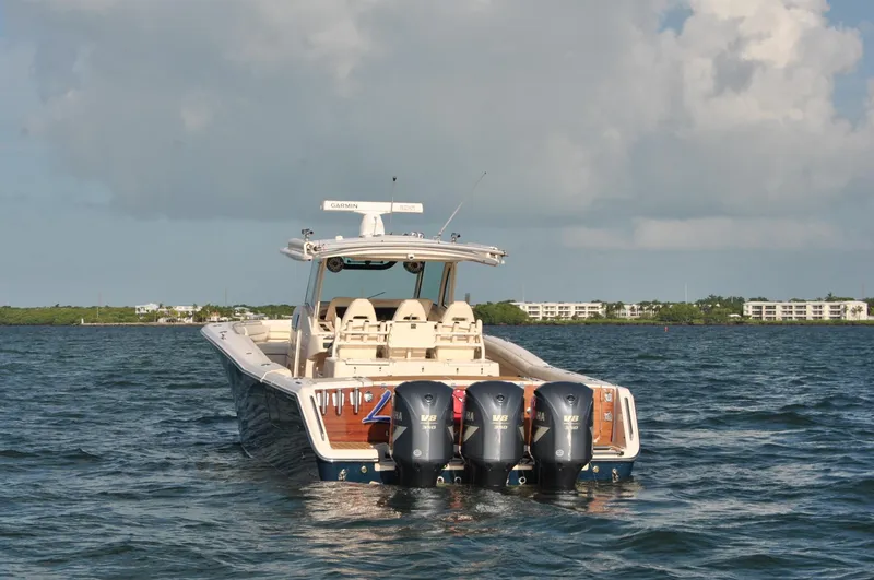 Yacht Photos Pics 2018 Grady-White Canyon 376 boat with triple engines on open water.