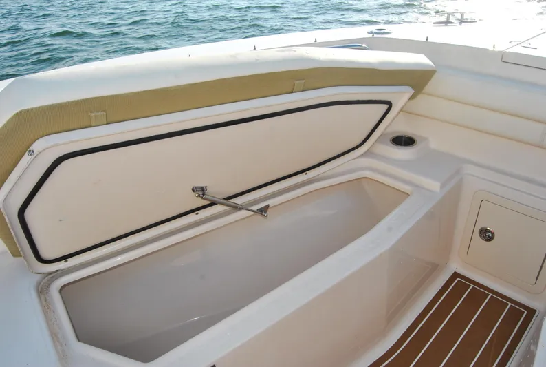  Yacht Photos Pics 2018 Grady-White Canyon 376 boat storage compartment open by the sea.