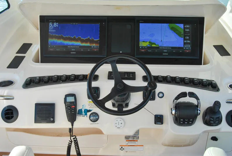  Yacht Photos Pics Helm of 2018 Grady-White Canyon 376 with dual navigation screens and controls.