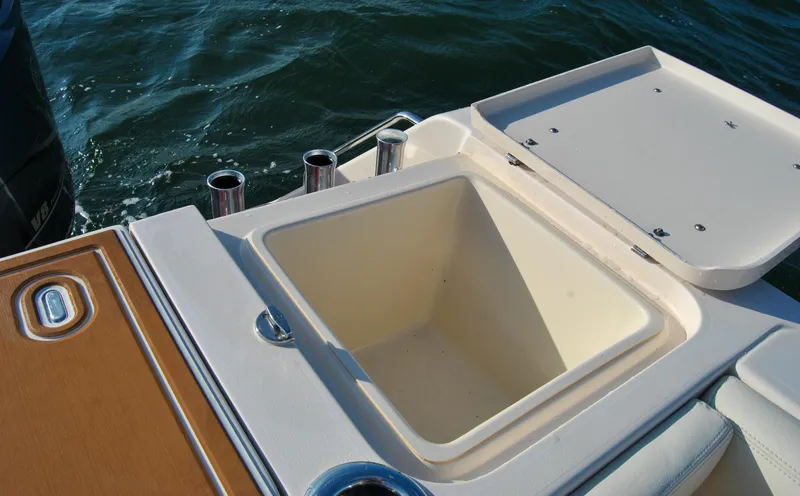  Yacht Photos Pics Open storage compartment on 2018 Grady-White Canyon 376 boat, near water.