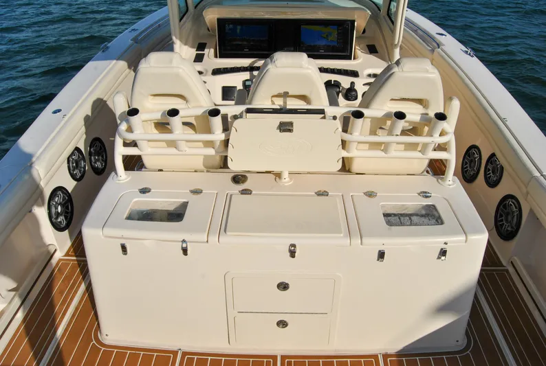  Yacht Photos Pics 2018 Grady-White Canyon 376 boat interior with helm, seating, and storage compartments.