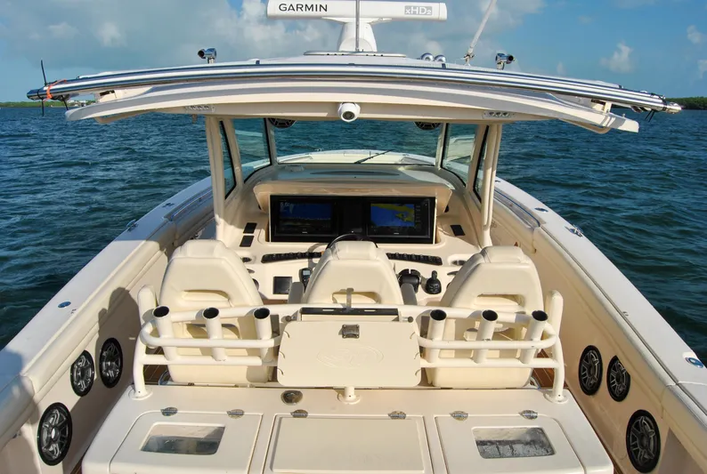  Yacht Photos Pics 2018 Grady-White Canyon 376 boat interior with helm, seating, and Garmin electronics.