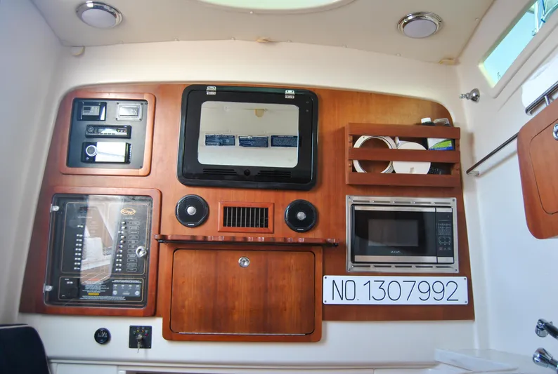  Yacht Photos Pics Interior of 2018 Grady-White Canyon 376 boat with control panel and microwave.