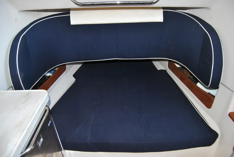  Yacht Photos Pics 2018 Grady-White Canyon 376 cabin interior with blue cushioned seating.