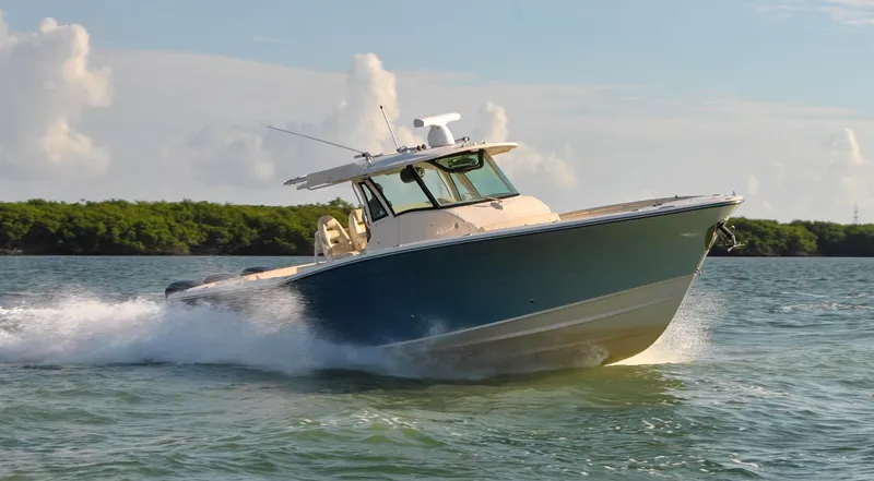  Yacht Photos Pics 2018 Grady-White Canyon 376 boat cruising on water under clear sky.