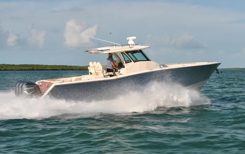  Yacht Photos Pics 2018 Grady-White Canyon 376 boat cruising on open water.