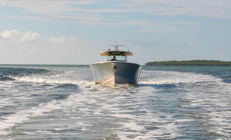  Yacht Photos Pics 2018 Grady-White Canyon 376 boat cruising on open water.