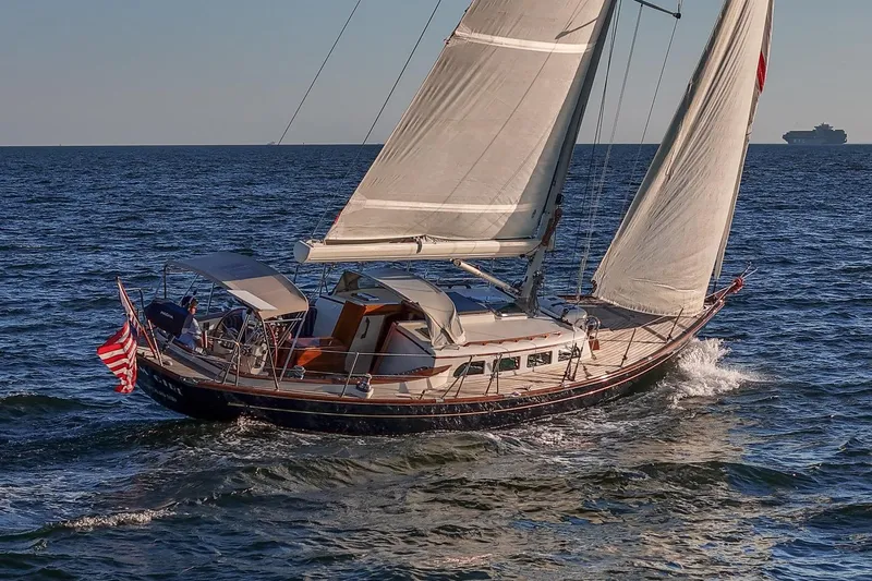 Dream Girl Yacht Photos Pics Sailing Morris Yachts M42, 2007 model, on open sea with American flag.