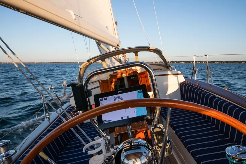 Dream Girl Yacht Photos Pics 2007 Morris Yachts M42 sailing on open water, featuring a wooden helm and navigation display.