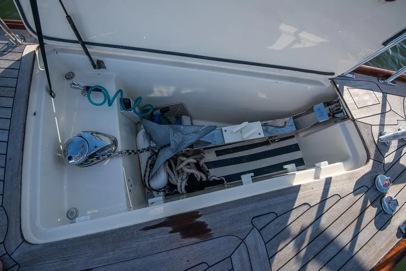 Dream Girl Yacht Photos Pics Open storage compartment on 2007 Morris Yachts M42, featuring anchor and coiled hose.