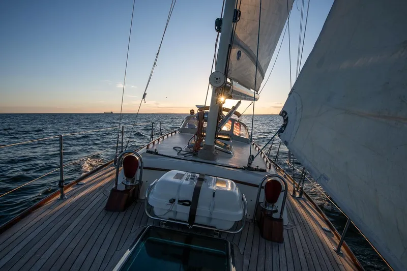 Dream Girl Yacht Photos Pics Sailing on a 2007 Morris Yachts M42 at sunset, open sea view.
