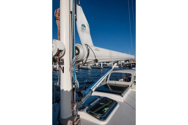 Dream Girl Yacht Photos Pics 2007 Morris Yachts M42 sailboat with mast and boom, docked in a marina.