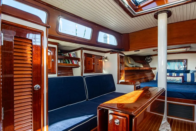Dream Girl Yacht Photos Pics Luxurious 2007 Morris Yachts M42 interior with elegant wood finish and cozy seating area.