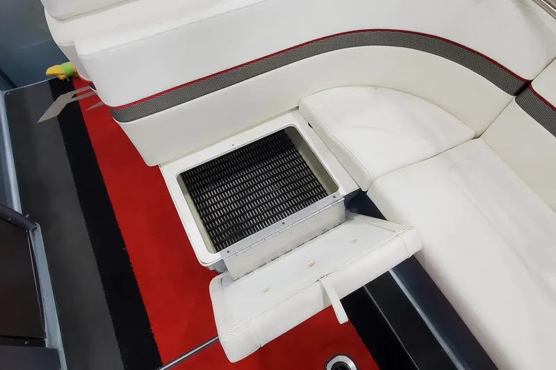  Yacht Photos Pics 2011 Formula 310 FX5 Bowrider interior with white seating and storage compartment.