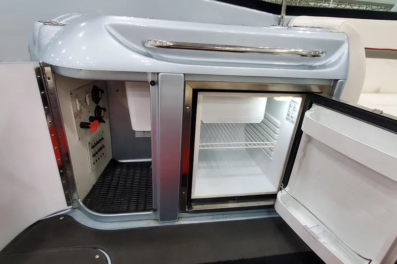  Yacht Photos Pics 2011 Formula 310 FX5 Bowrider interior with open mini fridge and control panel.