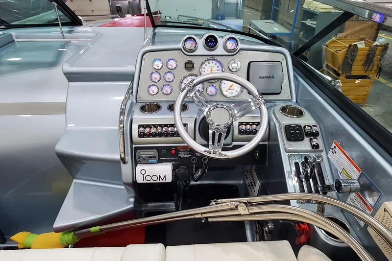  Yacht Photos Pics 2011 Formula 310 FX5 Bowrider dashboard with steering wheel and navigation instruments.