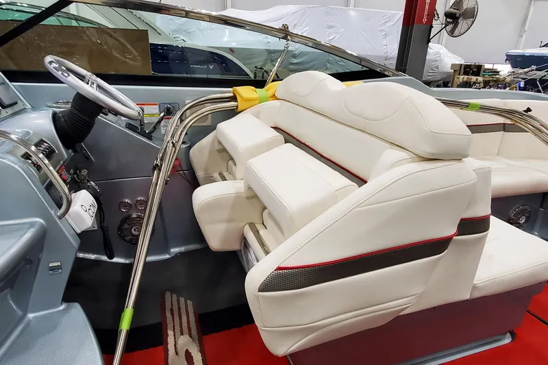  Yacht Photos Pics 2011 Formula 310 FX5 Bowrider interior with white leather seating and sleek dashboard design.