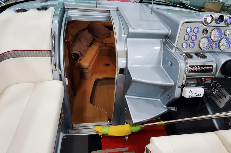  Yacht Photos Pics 2011 Formula 310 FX5 Bowrider interior with helm, gauges, and cabin entrance.