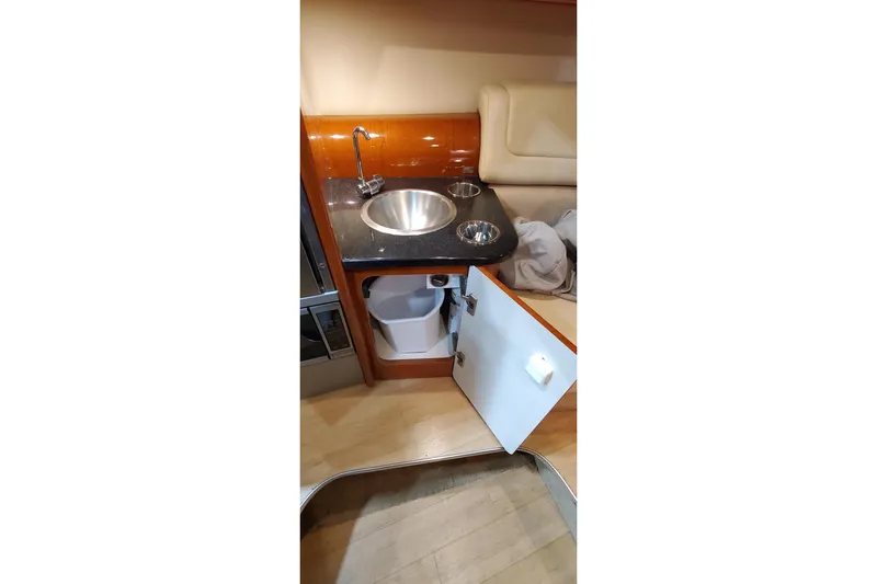  Yacht Photos Pics 2011 Formula 310 FX5 Bowrider interior with sink and storage cabinet.