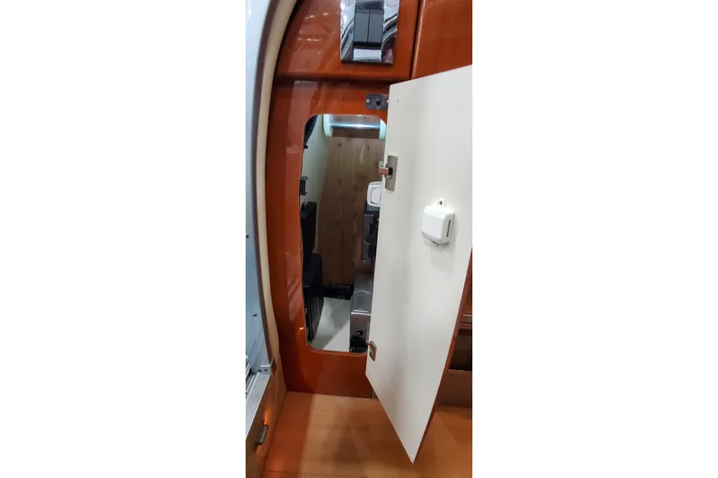  Yacht Photos Pics Interior view of 2011 Formula 310 FX5 Bowrider, featuring a wooden cabin door.