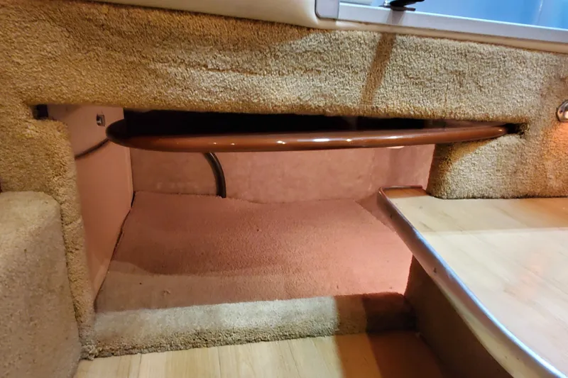  Yacht Photos Pics Interior storage space of 2011 Formula 310 FX5 Bowrider boat, featuring carpeted flooring.