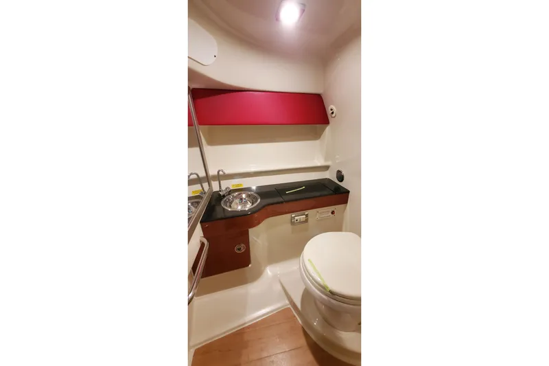  Yacht Photos Pics 2011 Formula 310 FX5 Bowrider bathroom with sink, toilet, and storage.